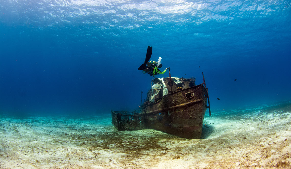 Diver approaching a shipwreck in Mexico